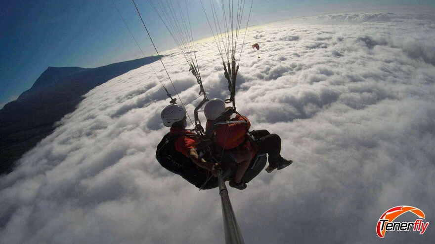 Paragliding in a sea of clouds